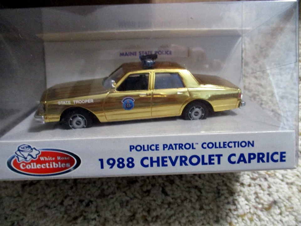 Chevrolet Caprice 1988 chapado en oro raro de la policía estatal de Maine rosa blanca 1/43 Foto 1 de 1