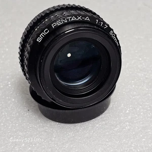 Neu - SMC Pentax-A Objektiv 50 mm f/1,7 mit Rückdeckel, offene Verpackung.  - Bild 1 von 13