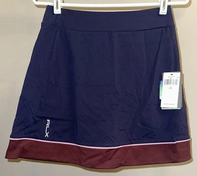 Falda corta RLX Ralph Lauren con bandas entrelazadas envoltura sintética en azul marino - talla XS Foto 1 de 3