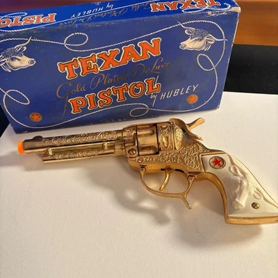 Pistola de juguete de lujo enchapada en oro marca Hubley Texas con caja años 50 vintage Foto 1 de 4