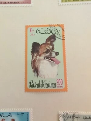 RAS AL KHAIMA  MICHEL IMPERFORATE DELUXE MINI-SHEET  MNH DOG TOPICAL SPITZ  - Image 1 of 4