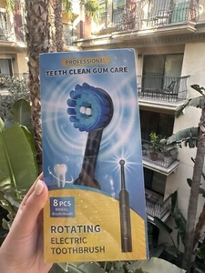 Rotating Electric Toothbrush for Adults with 8 Brush Heads - Picture 1 of 2