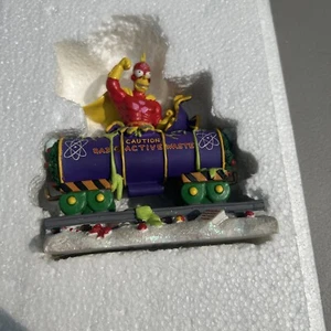The Simpsons Christmas Express "A Little Holiday Action" Radioactive Man 2004 - Picture 1 of 4