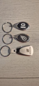NFL Keychains Set Of 3 Tennessee Titans Baltimore Ravens Greenbay Packers - Picture 1 of 4