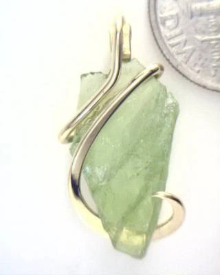 9.97ct Peridot Rough in Hand Forged 14kt Gold Art Wire Wrap Pendant - Image 1 of 4