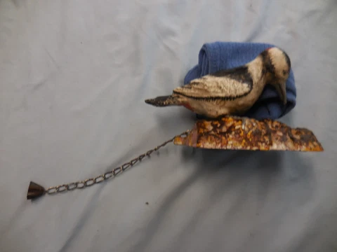 cast iron red headed woodpecker door knocker Cover