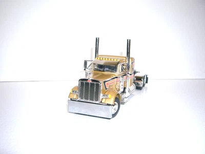 DCP FIRST GEAR 1/64 GOLD W/T BLACK &ORANGE STRIPES PETERBILT 379 W/T 36" SLEEPER - Image 1 of 4