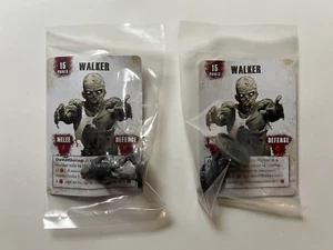 WALKING DEAD ALL OUT WAR GAME WALKER MINIATURE & PROMO CARD SEALED X 2 - Picture 1 of 2