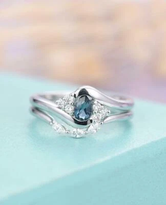 Conjunto de anillo nupcial curvo topacio azul Londres pera creado en laboratorio de 2 quilates chapado en oro blanco Foto 1 de 4