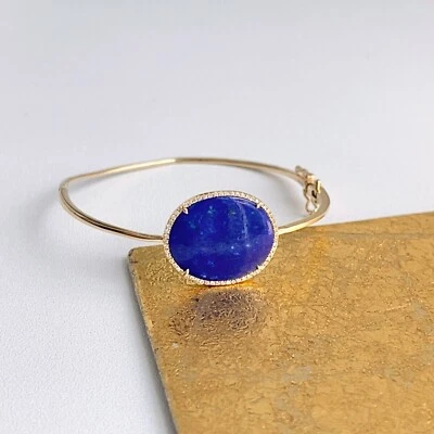 Brazalete fino Estate de oro amarillo de 14 quilates con halo de diamantes de lapislázuli azul ovalado de 6" Foto 1 de 4