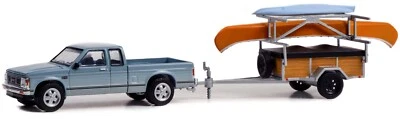 Enganche y remolque Greenight 1:64 serie 25 - 1988 GMC S-15 Sierra con canoa GL 32250C Foto 1 de 3