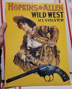Letrero de pared de hojalata de colección ""Hopkins & Allen Wild West Revolver"" Salvaje Oeste Dama 14,5 x 11 - Imagen 1 de 6