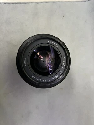 Minolta AF Zoom 35-70mm 1:3.5 (22)-4.5 lens Has Broken chunk of plastic Tested - Image 1 of 4