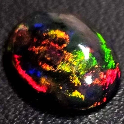 NATURAL AAA+ BEAUTIFUL COLORPLAY OVAL CABOCHAN  ETHIOPIAN WELO BLACKOPAL 1.60CTS - Image 1 of 3