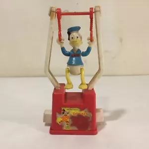 Vtg Plastic Walt Disney DONALD DUCK Trapeze PUSH BUTTON Toy Acrobat HONG KONG - Picture 1 of 9