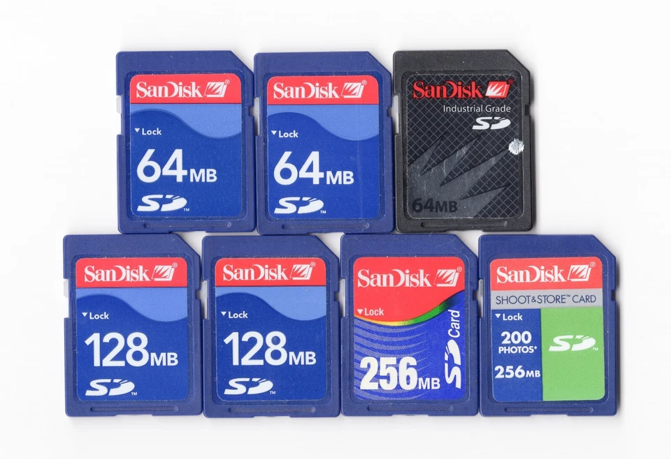 Lot Of 7x SanDisk 64MB / 128MB / 256MB MEGABYTE SD Camera Memory Cards - Image 1 of 1