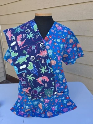 CUTE Unisex UA Stompin Dinosaur & Space Monster Scrub Top Size Medium lot 2 EUC - Image 1 of 4