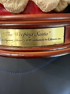 The Weeping Santa Holding Baby Jesus exclusively by Roman Inc. Wood Base 1997 - Picture 1 of 6