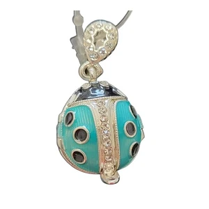 Russian Handmade Faux Pendant w/ Lt. Blue Lady Bug, w/ Flower Inside - Picture 1 of 3