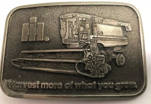 VINTAGE INTERNATIONAL SPEC CAST BELT BUCKLE HARVEST MORE OF WHAT YOUR GROW - Picture 1 of 2