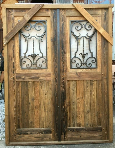 Double wooden Spanish door with hand forged wrought iron insert Cover