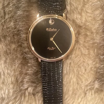 Reloj de cuarzo Dufonte vintage de Lucien Piccard, cara negra y acento dorado Foto 1 de 4
