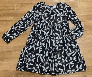 Vestido negro Cat & Jack para niña con dorado metálico y lazos talla 6-7 usado en excelente estado - Imagen 1 de 3