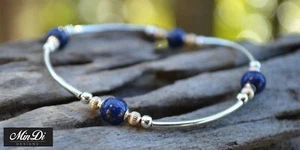 Pulsera elástica con relleno de oro amarillo 14K, lapislázuli y plata esterlina. - Imagen 1 de 5