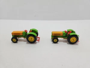 2 tractores agrícolas Siku Hanomag verde - amarillo escala 1:55 usados sin caja juguete alemán - Imagen 1 de 9