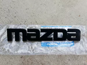 Mazda SA22C RX7 series 3 rear badge NEW F023-51-780 - Picture 1 of 2