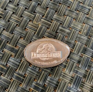 UNIVERSAL STUDIOS THEM PARK T-REX JURASSIC WORLD CLASSIC LOGO PENNY PRESSED L@@K - Picture 1 of 1