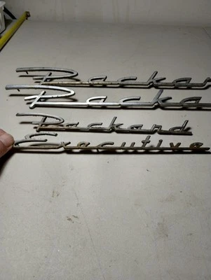 Original set of 4 PACKARD EXECUTIVE EMBLEMS Vintage Foto 1 de 4