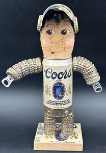"Lata de cerveza Risque Coors de colección mecánica divertida arte popular tapa de botella 12"" hombre" - Imagen 1 de 14