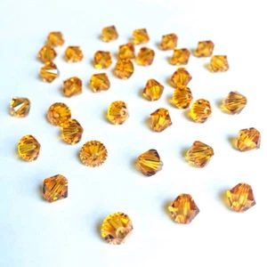 (24) 4mm Swarovski Crystal Bicones - Topaz - Picture 1 of 1