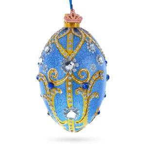 Joyas y rollos dorados en huevo de vidrio azul brillante adorno de Navidad 4 pulgadas - Imagen 1 de 5
