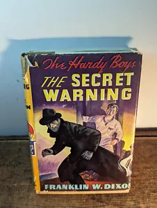 Hardy Boys The Secret Warning Yellow Spine HCDJ 1938 - Foto 1 di 5