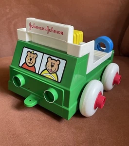 Camión de juguete Johnson & Johnson verde vintage pila y volteo con formas EE. UU. 1983 - Imagen 1 de 9