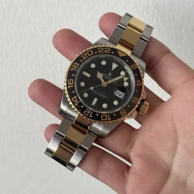 Rolex GMT-MASTER II Fecha 40 mm Oro 18k y Acero Esfera Negra Reloj Oyster 116713LN Foto 1 de 4