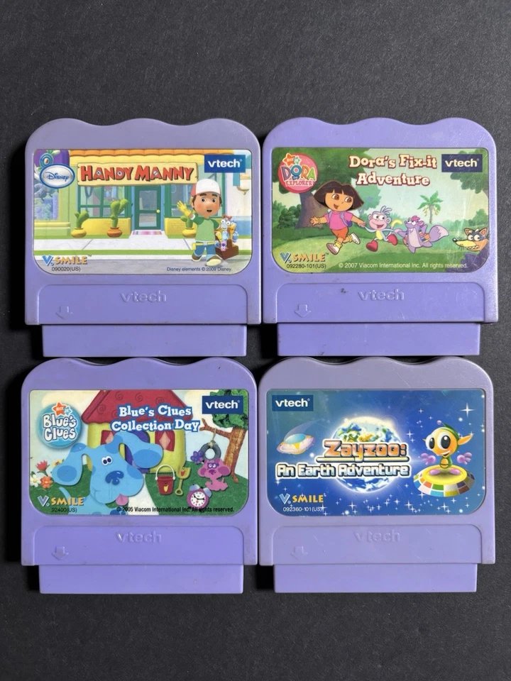 V TECH  V.SMILE LOT Of 4 Games Handy Manny Blues Clues Zay Zoo Dora Fix It - Image 1 of 1