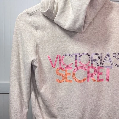 Chaqueta Victoria's Secret Cremallera Completa Manga Larga Bolsillos Sudadera con Capucha Gemas Logo DEFECTUOSA Foto 1 de 4