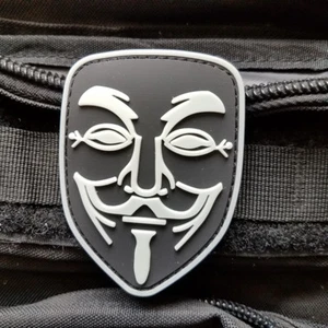 3D PVC GITD NOVELTY ANONYMOUS V FOR VENDETTA (a) GUY FAWKES RUBBER HOOK PATCH - Picture 1 of 3