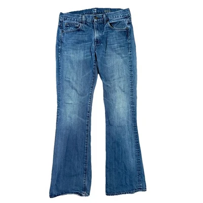 Pantalones de mezclilla 7 For All Mankind talla 32 x 32 Bootcut tiro medio descoloridos desgastados Foto 1 de 4