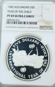 1983 SOLOMON ISLANDS SILVER 5 DOLLARS YEAR OF THE CHILD NGC PF 69 ULTRA CAMEO - Picture 1 of 3