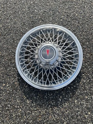 One 1982 a 1987 Pontiac Firebird Grand Prix 14 pulgadas cable radios tapacubos como nuevo Foto 1 de 4