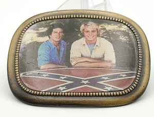 Fibbia cintura Dukes Of Hazzard Bo & Luke Duke 1981 vintage show memorabilia - Foto 1 di 4