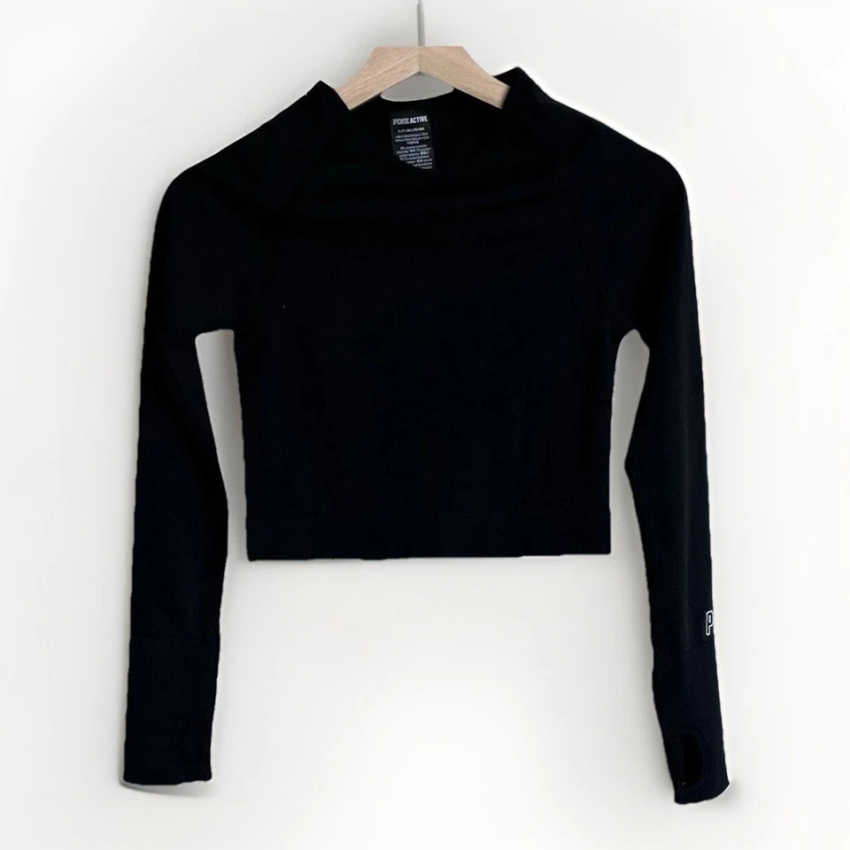 Top corto Victoria’s Secret ROSA activo manga larga negro talla pequeña. Gimnasio deportivo Foto 1 de 4