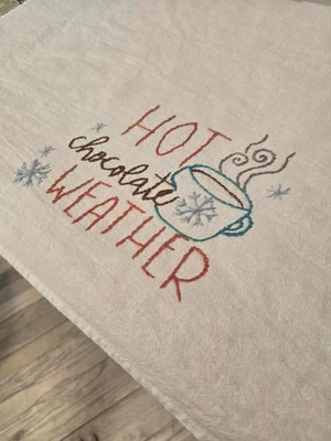 Toalla saco harina blanca bordada a mano para clima chocolate caliente Foto 1 de 4
