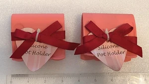 "Pepto Bismol" Pink Silicone Pot Pan Grip Holder 2pc Set with Red Ribbons - Picture 1 of 3