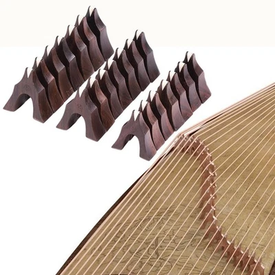 21 pezzi di ponti Guzheng in legno di supporto per pilastri tradizionali cinesi, - Immagine 1 di 4
