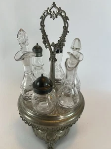 Antiguo juego de 6 botellas de vidrio grabadas con soporte giratorio para ruedas de plata - Imagen 1 de 21